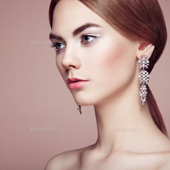 Fashion portrait of young beautiful woman with jewelry - Stock Photo - Images