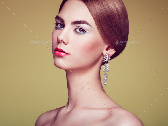 Fashion portrait of young beautiful woman with jewelry - Stock Photo - Images