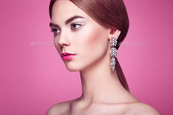 Fashion portrait of young beautiful woman with jewelry - Stock Photo - Images