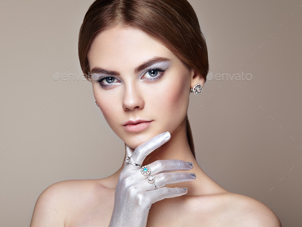 Fashion portrait of young beautiful woman with jewelry - Stock Photo - Images
