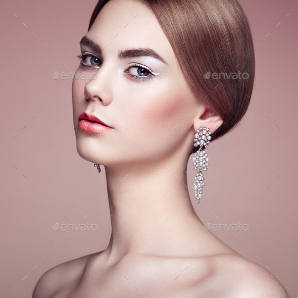 Fashion portrait of young beautiful woman with jewelry - Stock Photo - Images