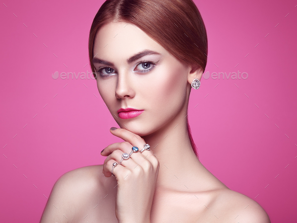 Fashion portrait of young beautiful woman with jewelry - Stock Photo - Images