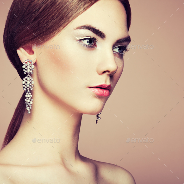 Fashion portrait of young beautiful woman with jewelry - Stock Photo - Images