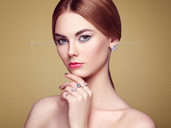 Fashion portrait of young beautiful woman with jewelry - Stock Photo - Images
