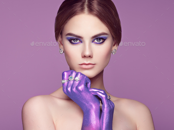 Fashion portrait of young beautiful woman with jewelry - Stock Photo - Images