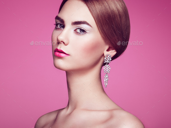 Fashion portrait of young beautiful woman with jewelry - Stock Photo - Images