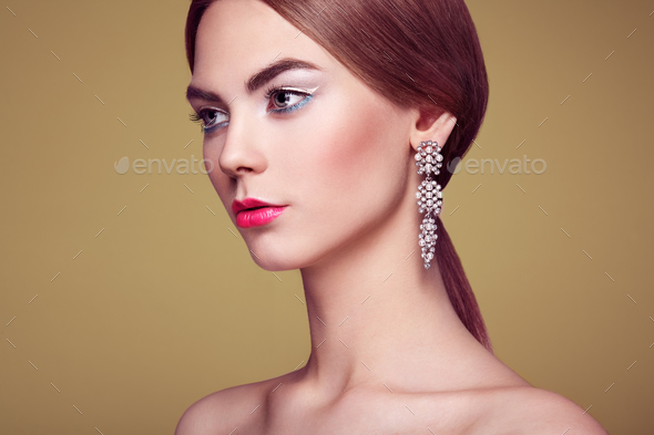 Fashion portrait of young beautiful woman with jewelry - Stock Photo - Images