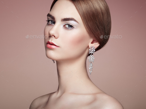 Fashion portrait of young beautiful woman with jewelry - Stock Photo - Images