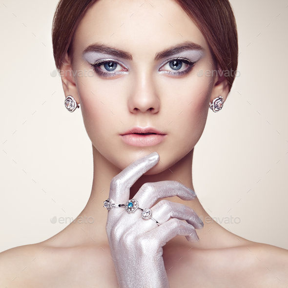 Fashion portrait of young beautiful woman with jewelry - Stock Photo - Images