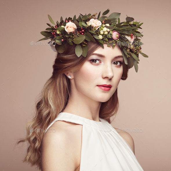 Beautiful blonde woman with flower wreath on her head - Stock Photo - Images