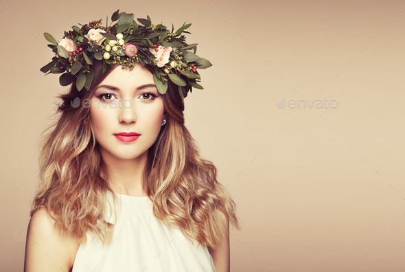 Beautiful blonde woman with flower wreath on her head - Stock Photo - Images