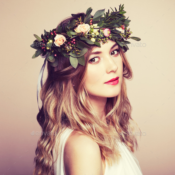Beautiful blonde woman with flower wreath on her head - Stock Photo - Images