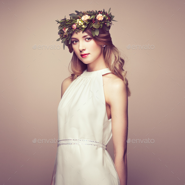 Beautiful blonde woman with flower wreath on her head - Stock Photo - Images