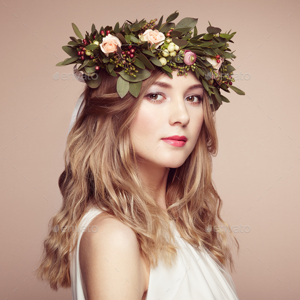 Beautiful blonde woman with flower wreath on her head - Stock Photo - Images