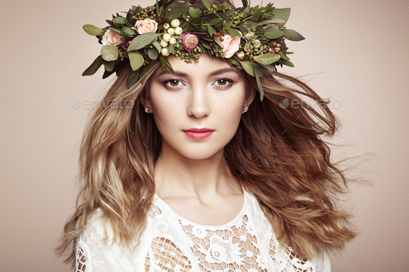 Beautiful blonde woman with flower wreath on her head - Stock Photo - Images