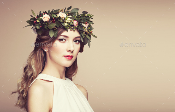 Beautiful blonde woman with flower wreath on her head - Stock Photo - Images