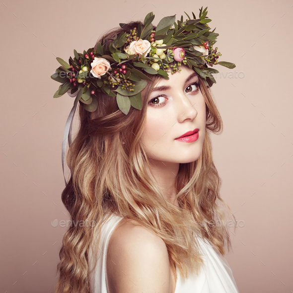 Beautiful blonde woman with flower wreath on her head - Stock Photo - Images