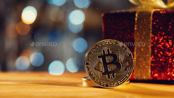 Bitcoin BTC cryptocurrency and Christmas gift box - Stock Photo - Images