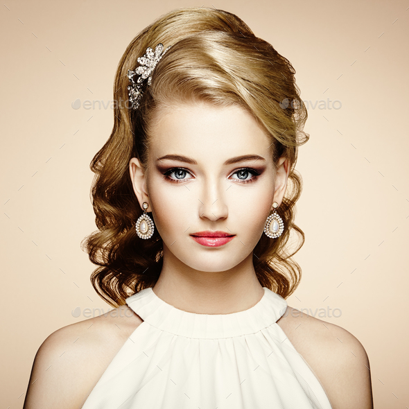 Fashion portrait of young beautiful woman with elegant hairstyle - Stock Photo - Images