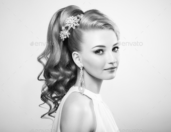 Black and white photo of beautiful woman with elegant hairstyle