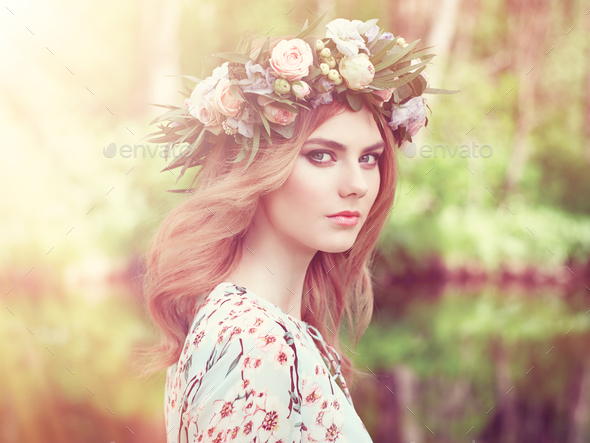 Beautiful blonde woman with flower wreath on her head - Stock Photo - Images