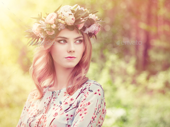 Beautiful blonde woman with flower wreath on her head - Stock Photo - Images