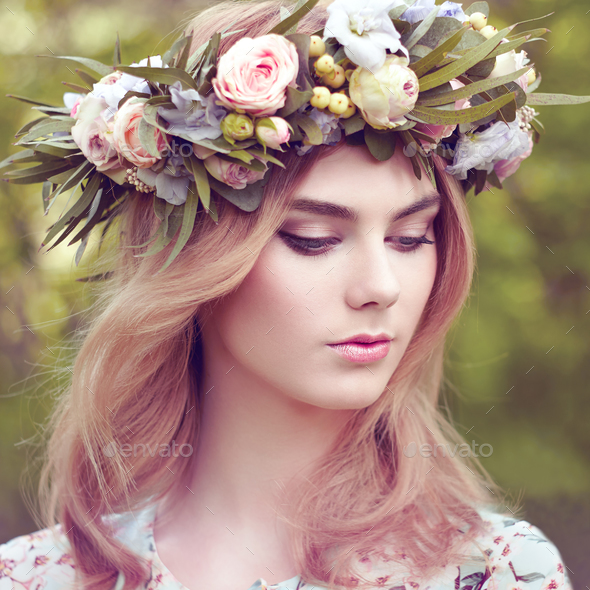 Beautiful blonde woman with flower wreath on her head - Stock Photo - Images