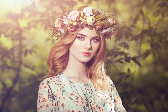Beautiful blonde woman with flower wreath on her head - Stock Photo - Images