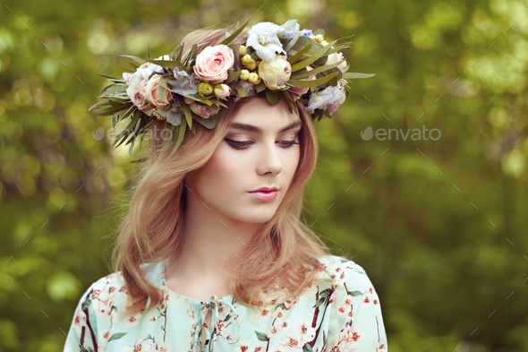 Beautiful blonde woman with flower wreath on her head - Stock Photo - Images