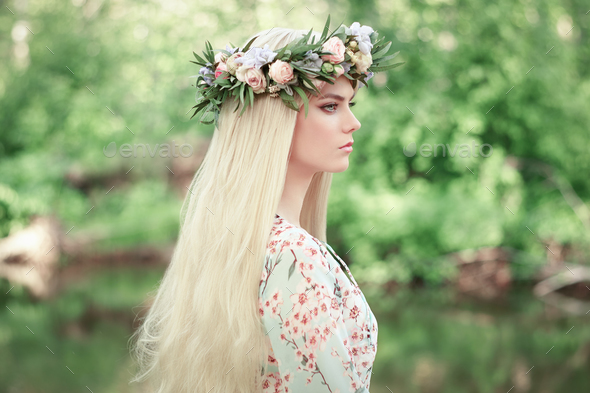 Beautiful blonde woman with flower wreath on her head - Stock Photo - Images