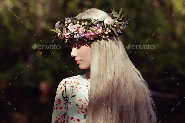 Beautiful blonde woman with flower wreath on her head - Stock Photo - Images