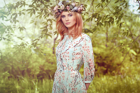 Beautiful blonde woman with flower wreath on her head - Stock Photo - Images