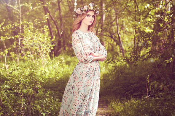 Beautiful blonde woman with flower wreath on her head - Stock Photo - Images