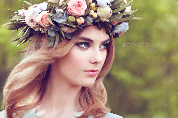 Beautiful blonde woman with flower wreath on her head - Stock Photo - Images