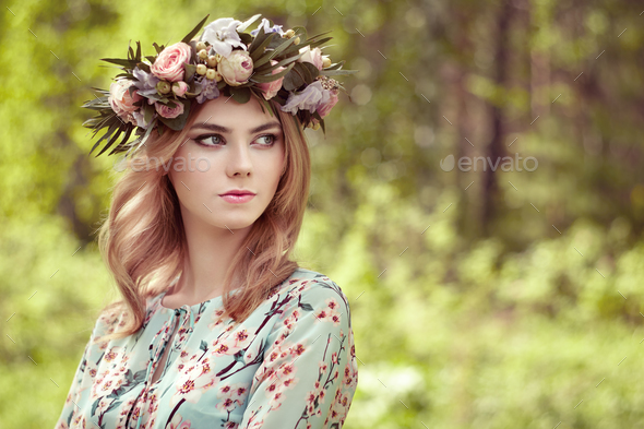 Beautiful blonde woman with flower wreath on her head - Stock Photo - Images