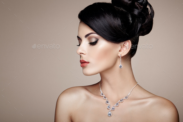 Fashion portrait of young beautiful woman with jewelry - Stock Photo - Images