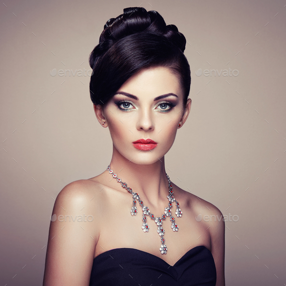 Fashion portrait of young beautiful woman with jewelry - Stock Photo - Images