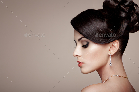 Fashion portrait of young beautiful woman with jewelry - Stock Photo - Images