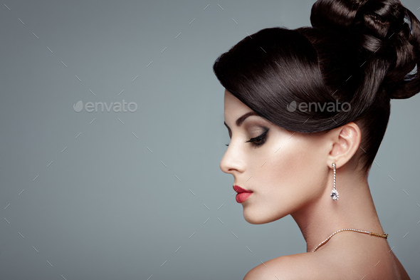 Fashion portrait of young beautiful woman with elegant hairstyle - Stock Photo - Images