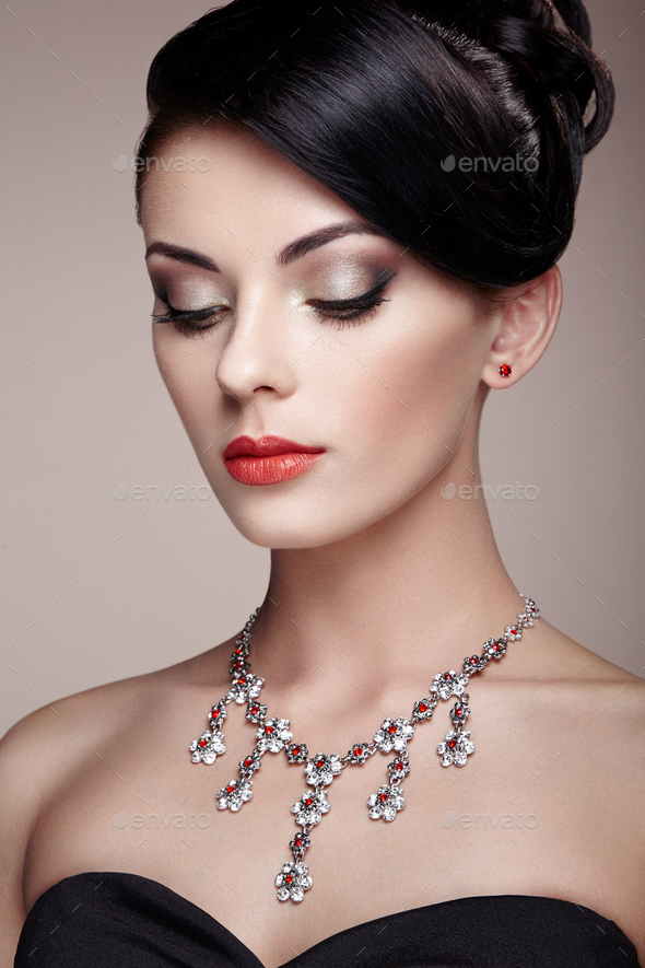 Fashion portrait of young beautiful woman with jewelry - Stock Photo - Images
