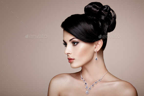 Fashion portrait of young beautiful woman with jewelry - Stock Photo - Images