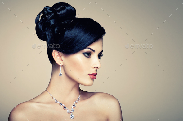 Fashion portrait of young beautiful woman with jewelry - Stock Photo - Images