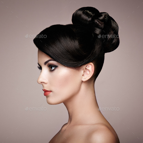 Fashion portrait of young beautiful woman with elegant hairstyle - Stock Photo - Images