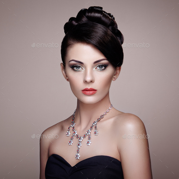 Fashion portrait of young beautiful woman with jewelry - Stock Photo - Images