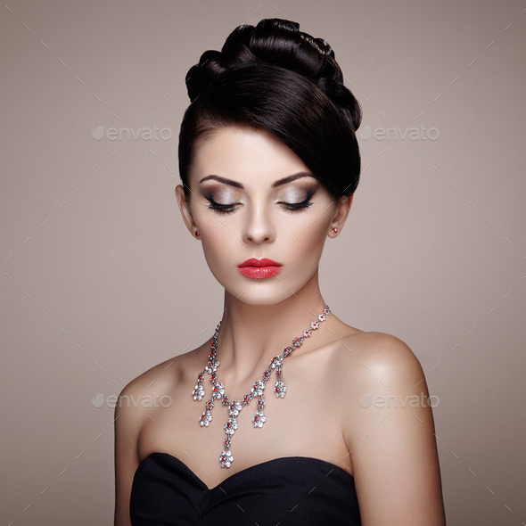 Fashion portrait of young beautiful woman with jewelry - Stock Photo - Images