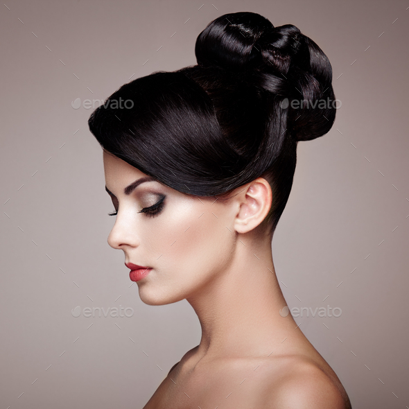 Fashion portrait of young beautiful woman with elegant hairstyle - Stock Photo - Images
