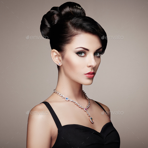 Fashion portrait of young beautiful woman with elegant hairstyle - Stock Photo - Images