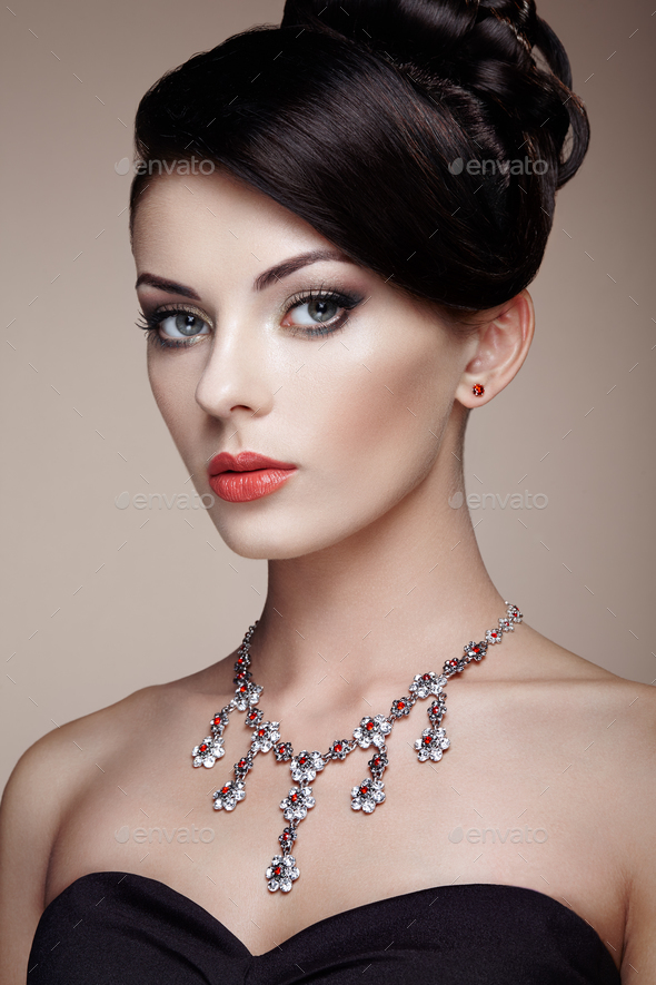 Fashion portrait of young beautiful woman with jewelry - Stock Photo - Images