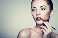 Beautiful woman paints lips with lipstick - PhotoDune Item for Sale