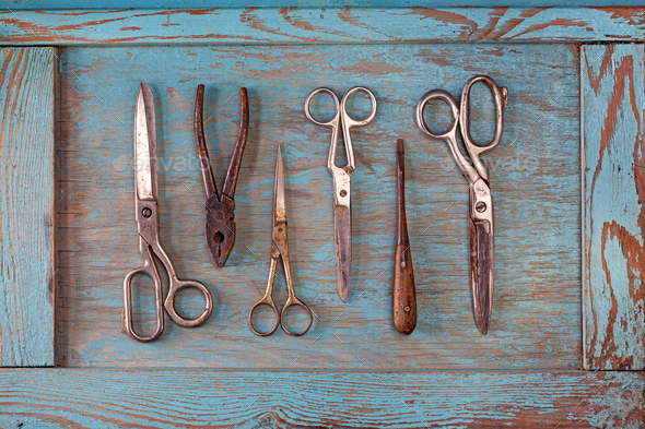 Collection of vintage tools on a blue wooden background - Stock Photo - Images